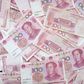 Renminbi hits highest level in two years against dollar.